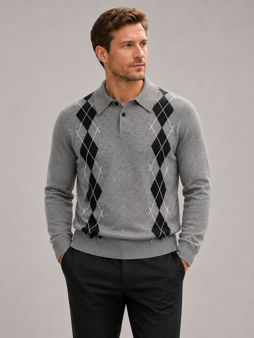Front view of a man wearing a gray argyle sweater with a contrast collar, long sleeves, and classic plaid knit pattern