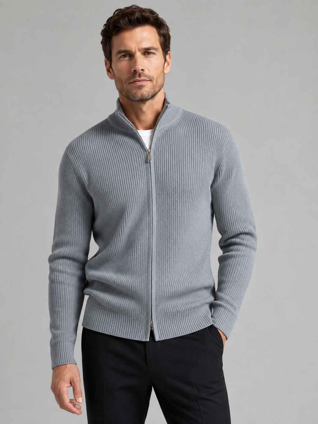 Front view of a man wearing a gray ribbed knit cardigan sweater with a full zip front, stand collar, slim fit, and long sleeves