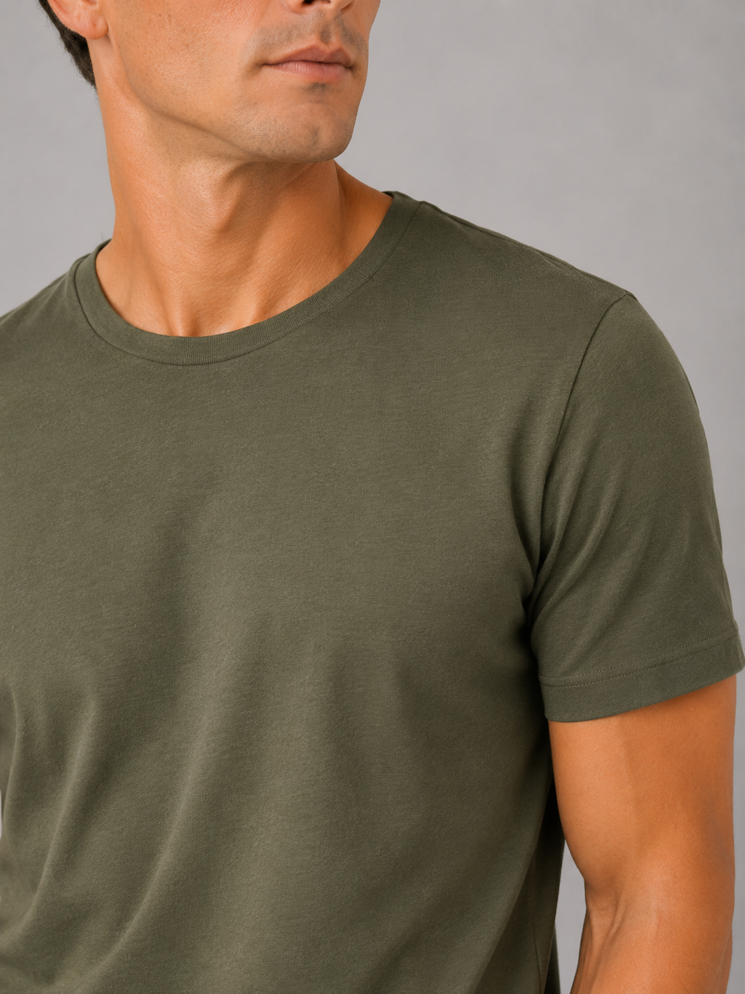 Close up of green cotton t shirt showing soft breathable fabric and clean crew neck detail