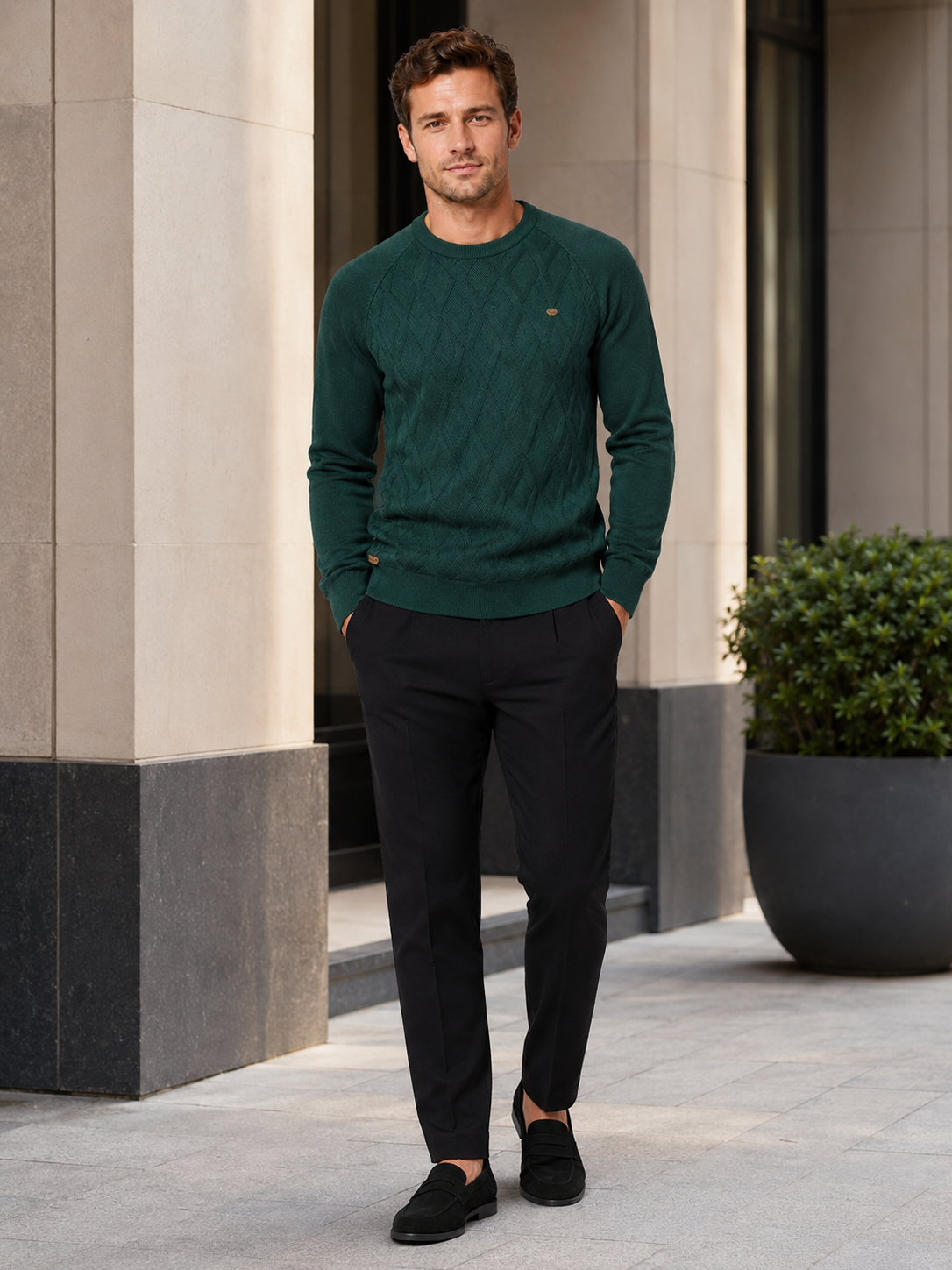 Man wearing a green argyle crew neck sweater in a smart casual winter outfit
