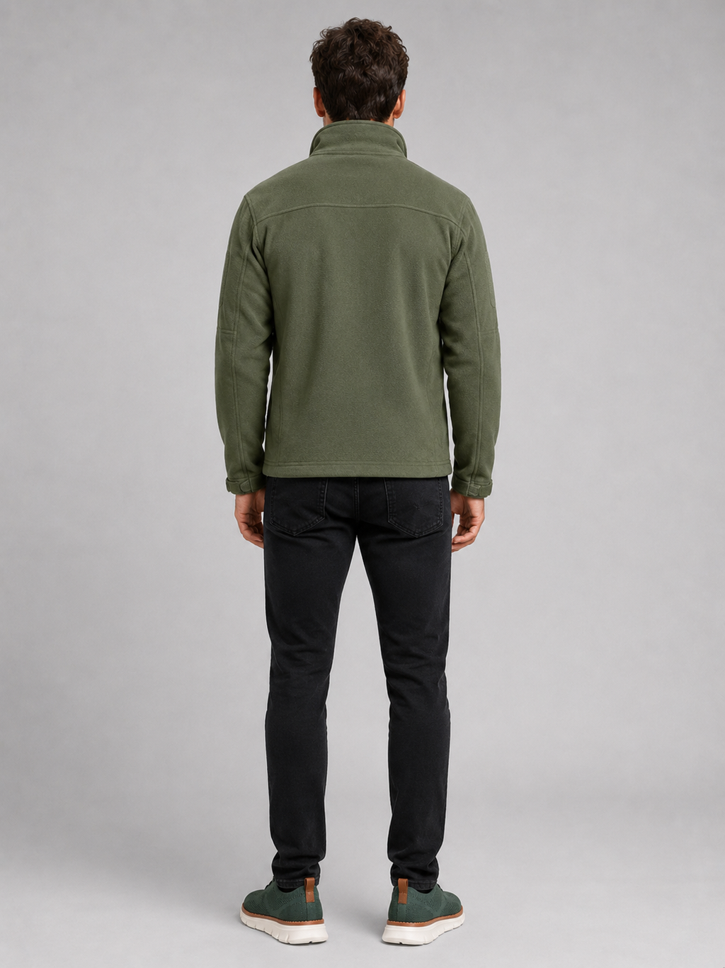 Back view of a man wearing a green fleece jacket showing the warm fleece construction, long sleeves, and comfortable outdoor fit