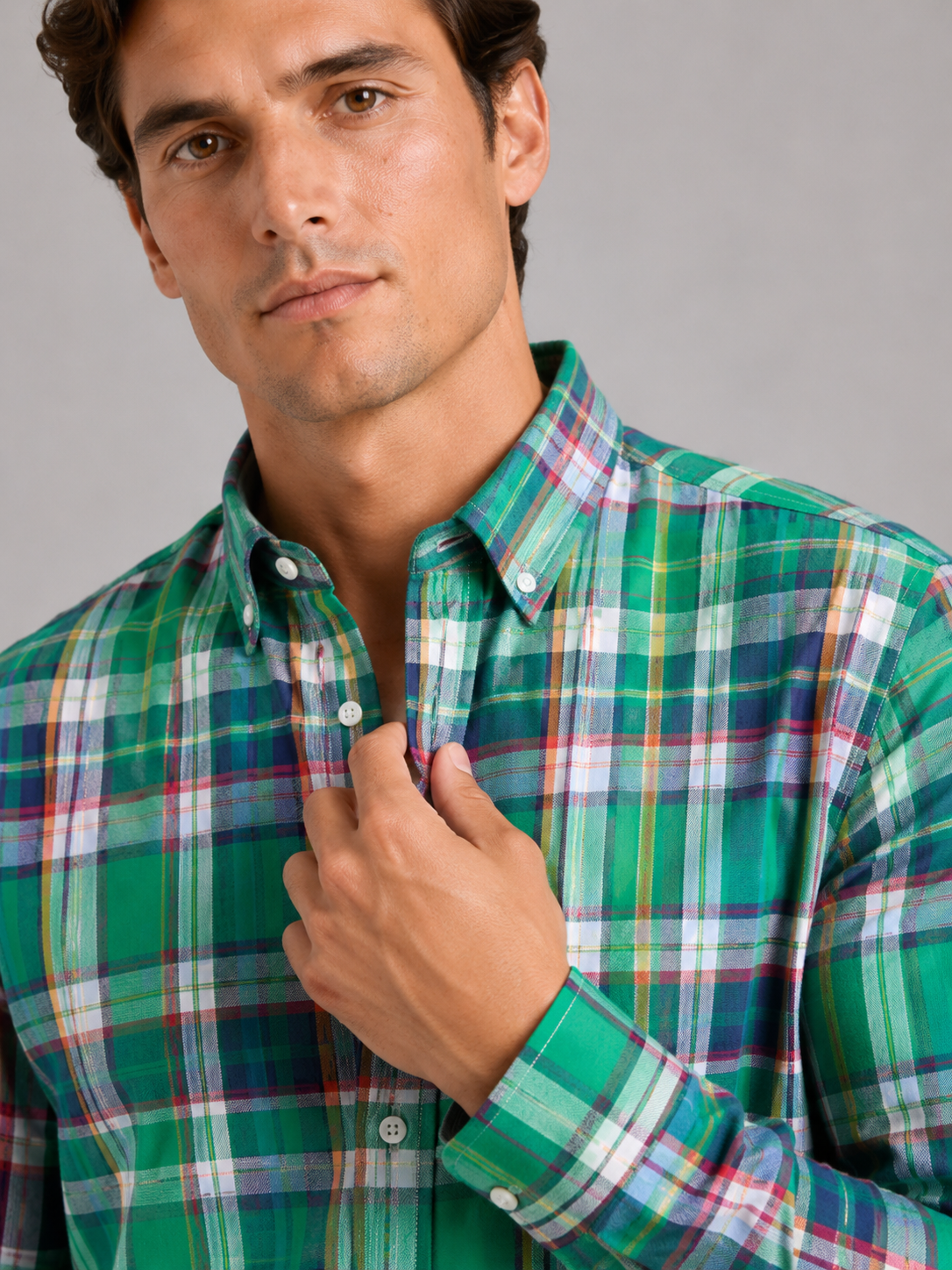 Close up of green madras shirt showing soft cotton fabric and plaid striped pattern detail