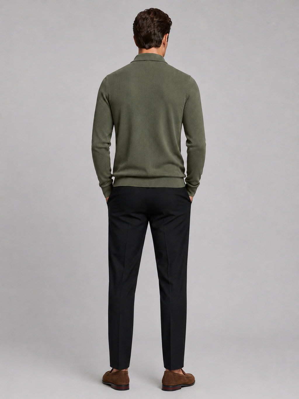 Back view of a man wearing a green quarter zip polo showing the long sleeves, structured collar, and comfortable fall fit