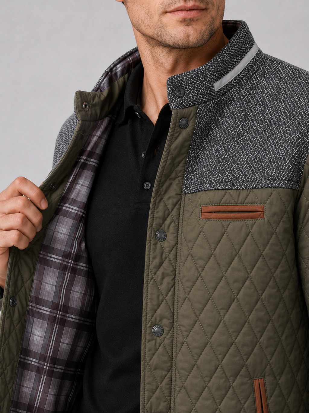 Close up of green quilted jacket showing diamond stitching and button down front detail