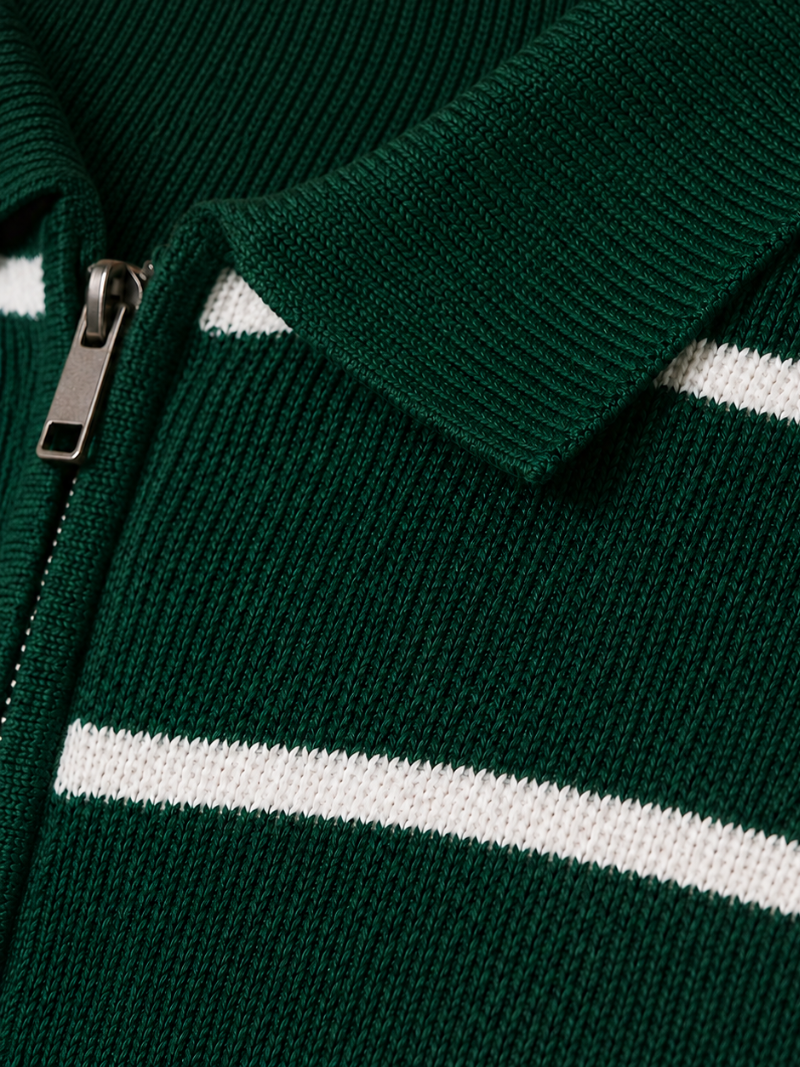 Close up of green striped knit polo fabric showing soft breathable texture and quarter zip detail