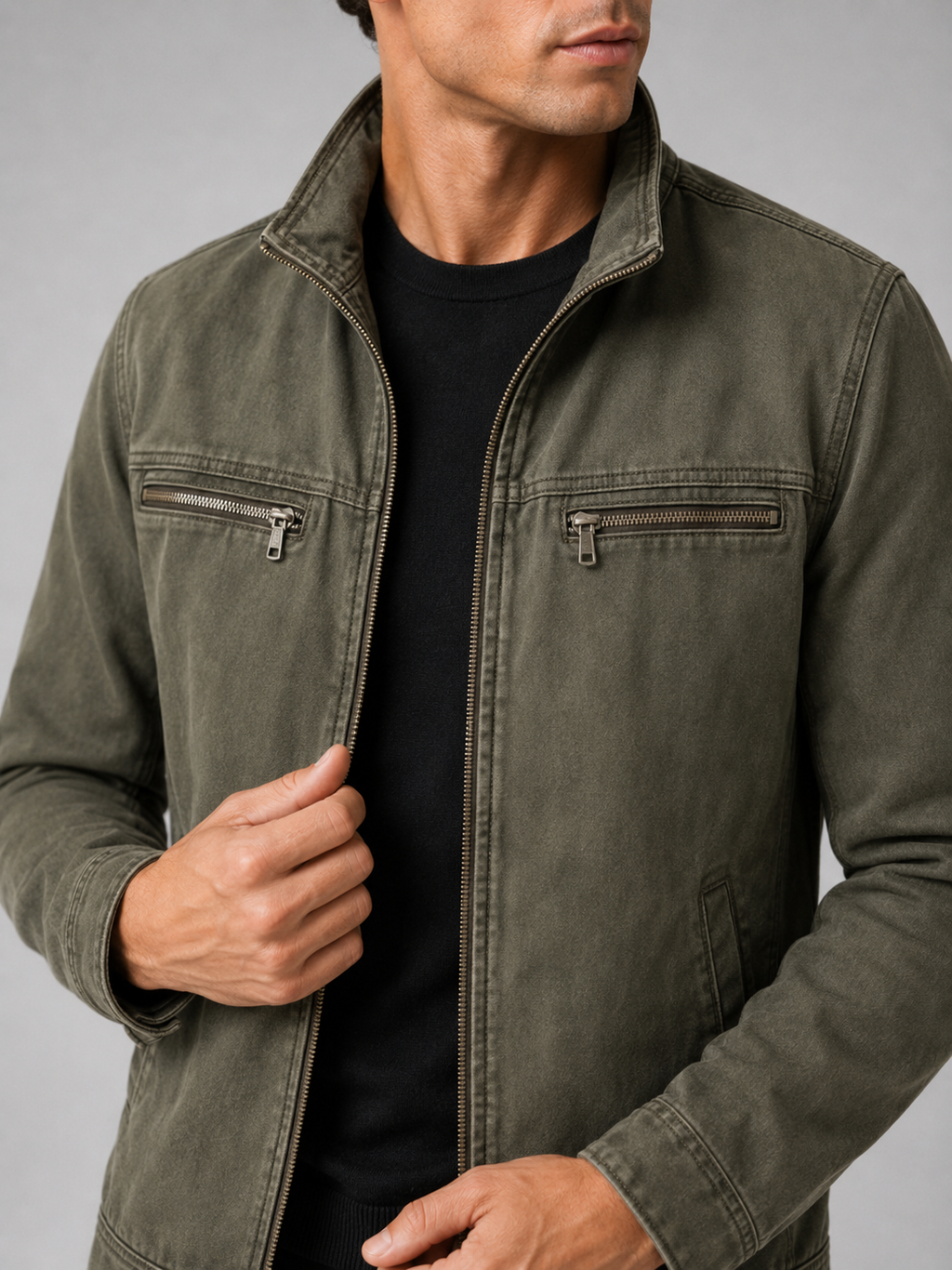 Close up of green washed cotton jacket showing soft vintage texture and refined lapel detail