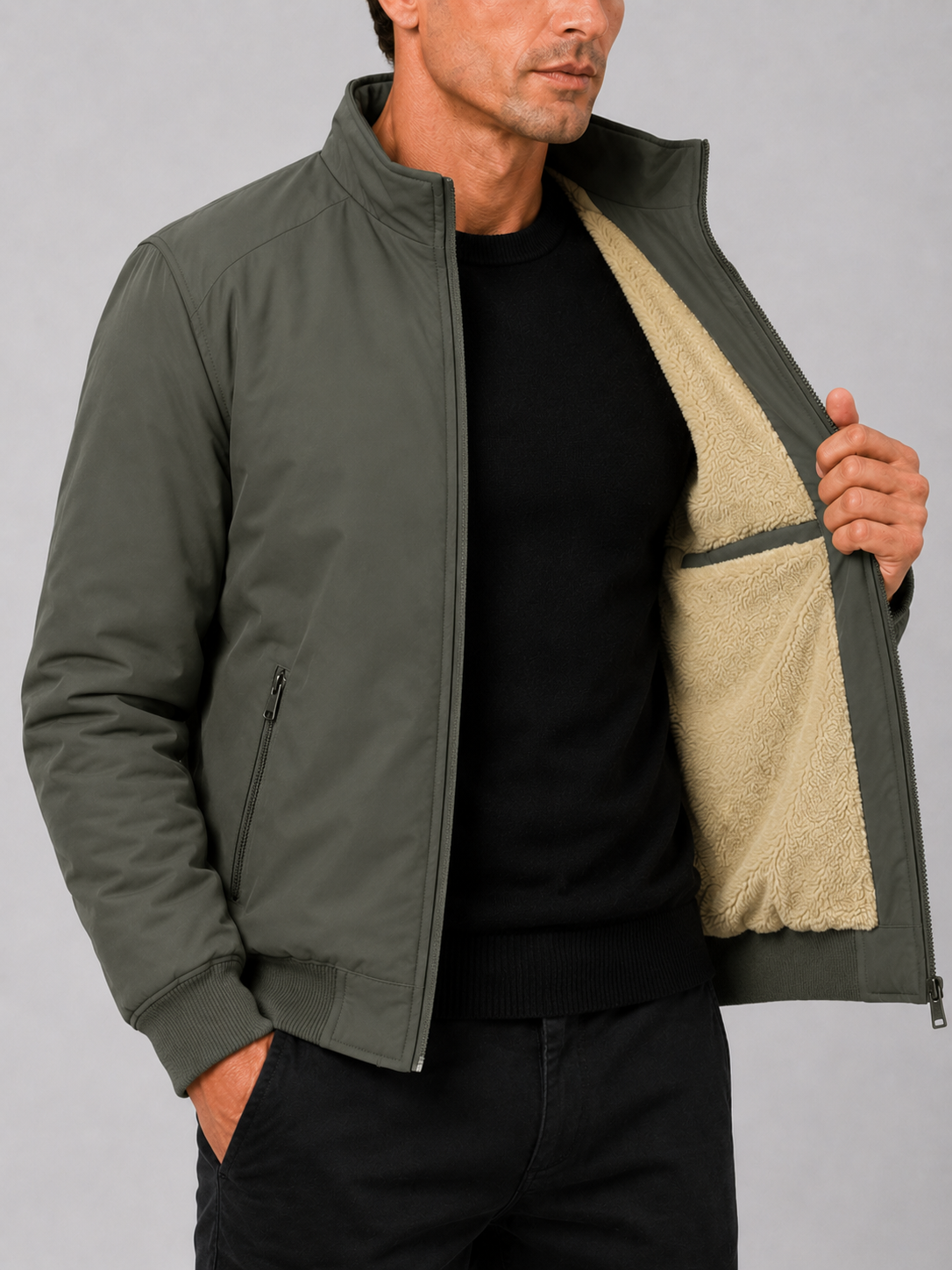 Close up of green fleece lined jacket showing soft thermal lining and durable outer fabric detail