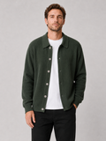 Men wearing green knit cardigan sweater open front lapel loose fit spring fall casual style