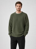 Men wearing green crewneck sweater loose fit solid color fall business casual style
