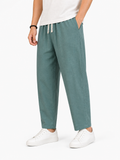 Men wearing green drawstring pants breathable loose fit lightweight relaxed summer style