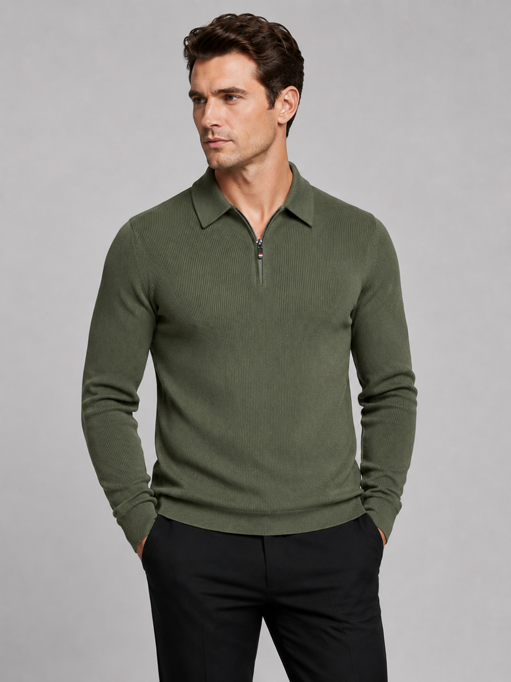 Front view of a man wearing a green quarter zip long sleeve polo with a lapel collar and tailored business casual fit
