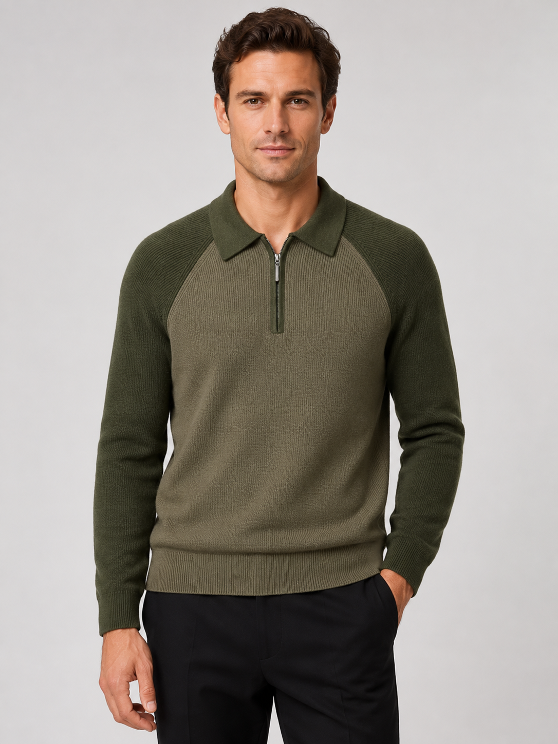 Front view of a man wearing a green slim fit quarter zip polo sweater with long sleeves and a knit collar
