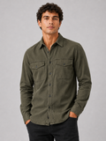 Men wearing green cotton washed work shirt long sleeve double pocket casual button up style