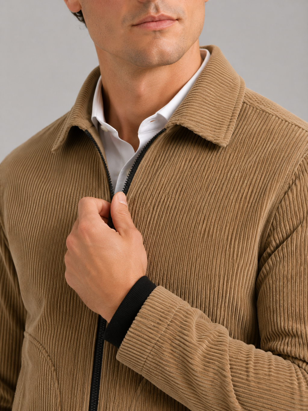 Close up of khaki corduroy jacket showing soft ribbed texture and warm fabric detail