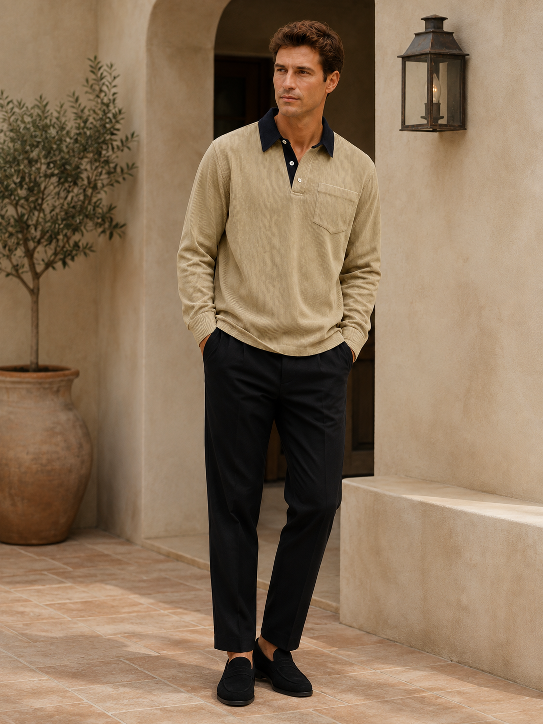 Man wearing a khaki corduroy long sleeve polo shirt in a casual fall everyday outfit