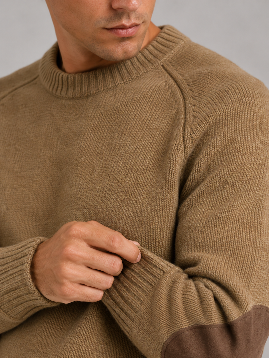 Close up of khaki wool knit sweater showing thick warm texture and clean crew neck detail