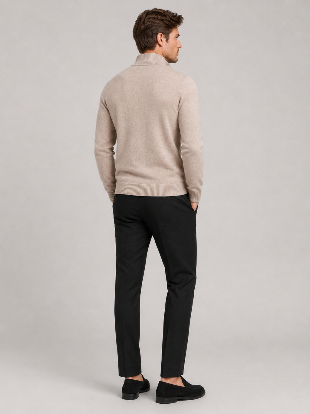 Back view of a man wearing a khaki full zip knit sweater showing the slim fit, long sleeves, and clean knit construction