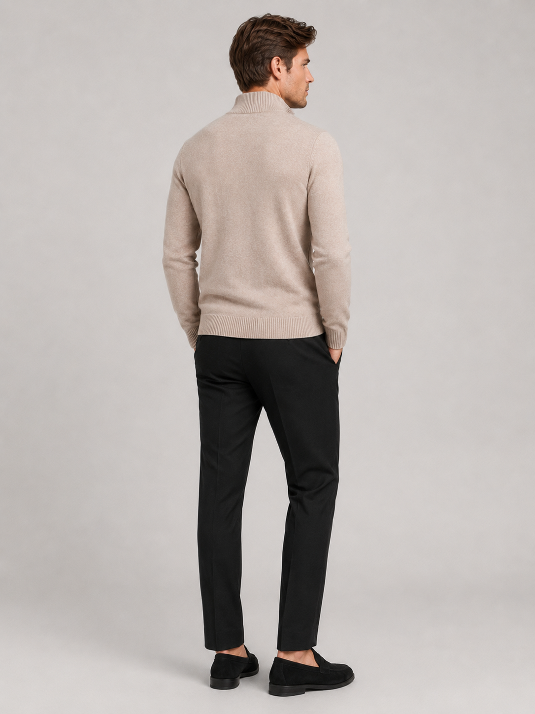 Back view of a man wearing a khaki full zip knit sweater showing the slim fit, long sleeves, and clean knit construction