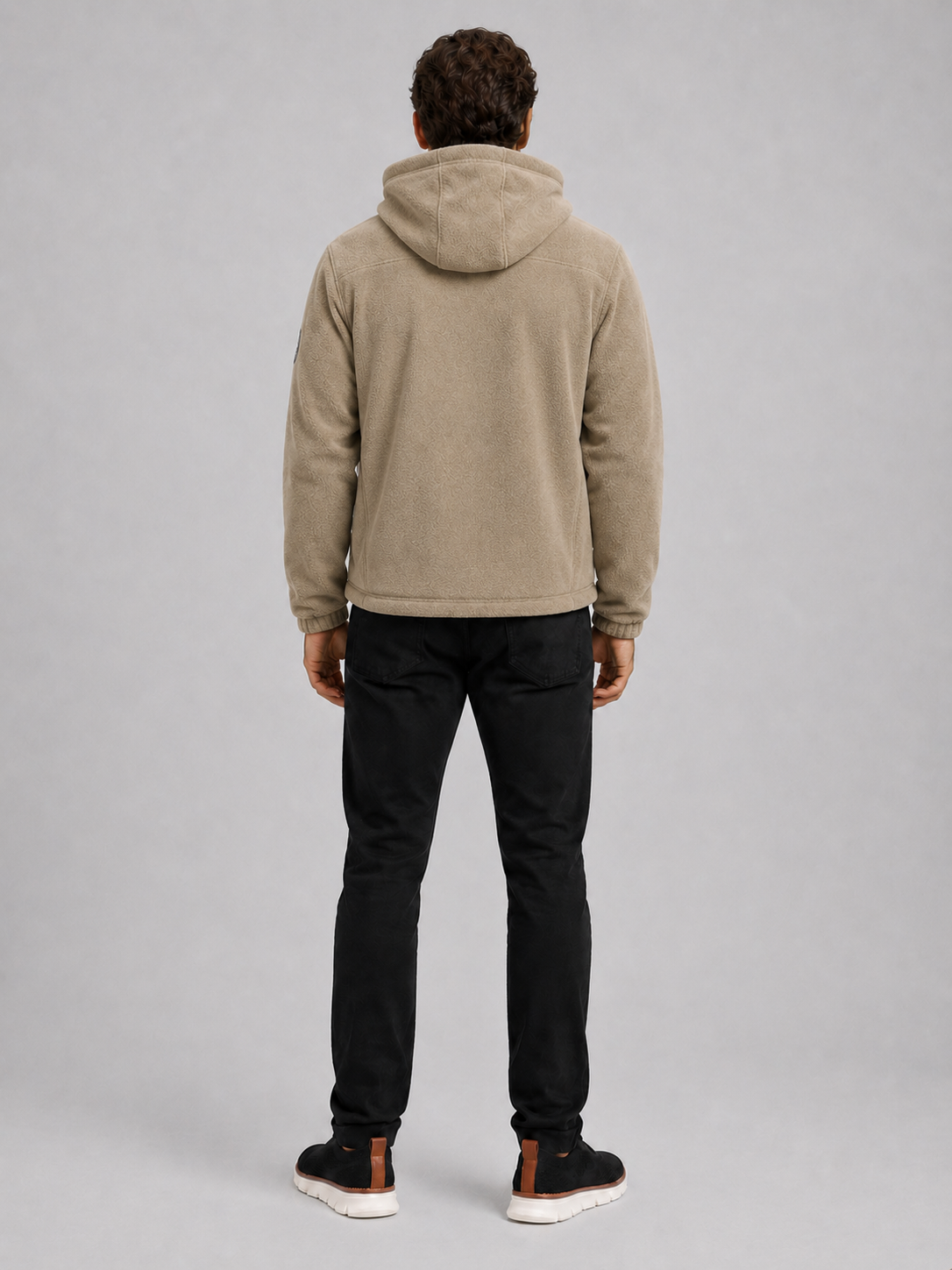 Back view of a man wearing a khaki hooded fleece jacket showing the attached hood, thick fleece construction, long sleeves, and comfortable outdoor fit