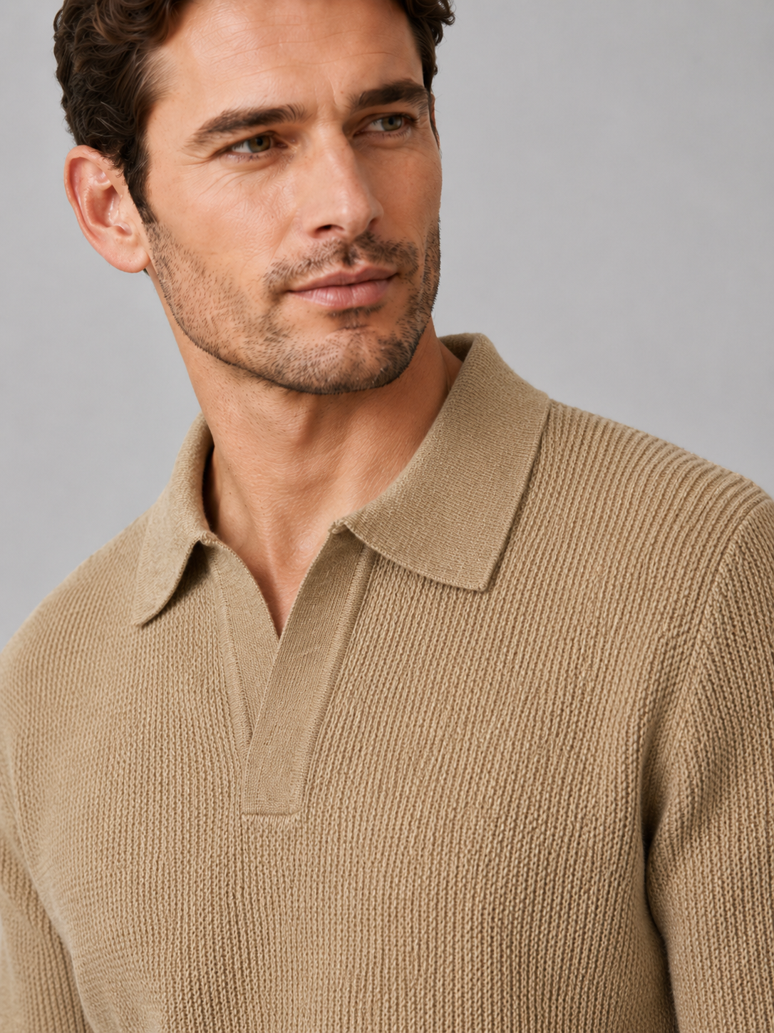 Back view of a man wearing a khaki Johnny collar sweater showing the heavyweight knit and relaxed fit