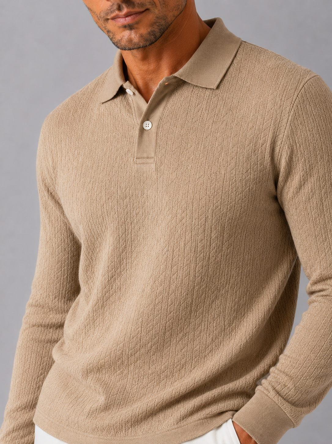 Close up of khaki knit polo shirt showing soft textured fabric and refined collar detail