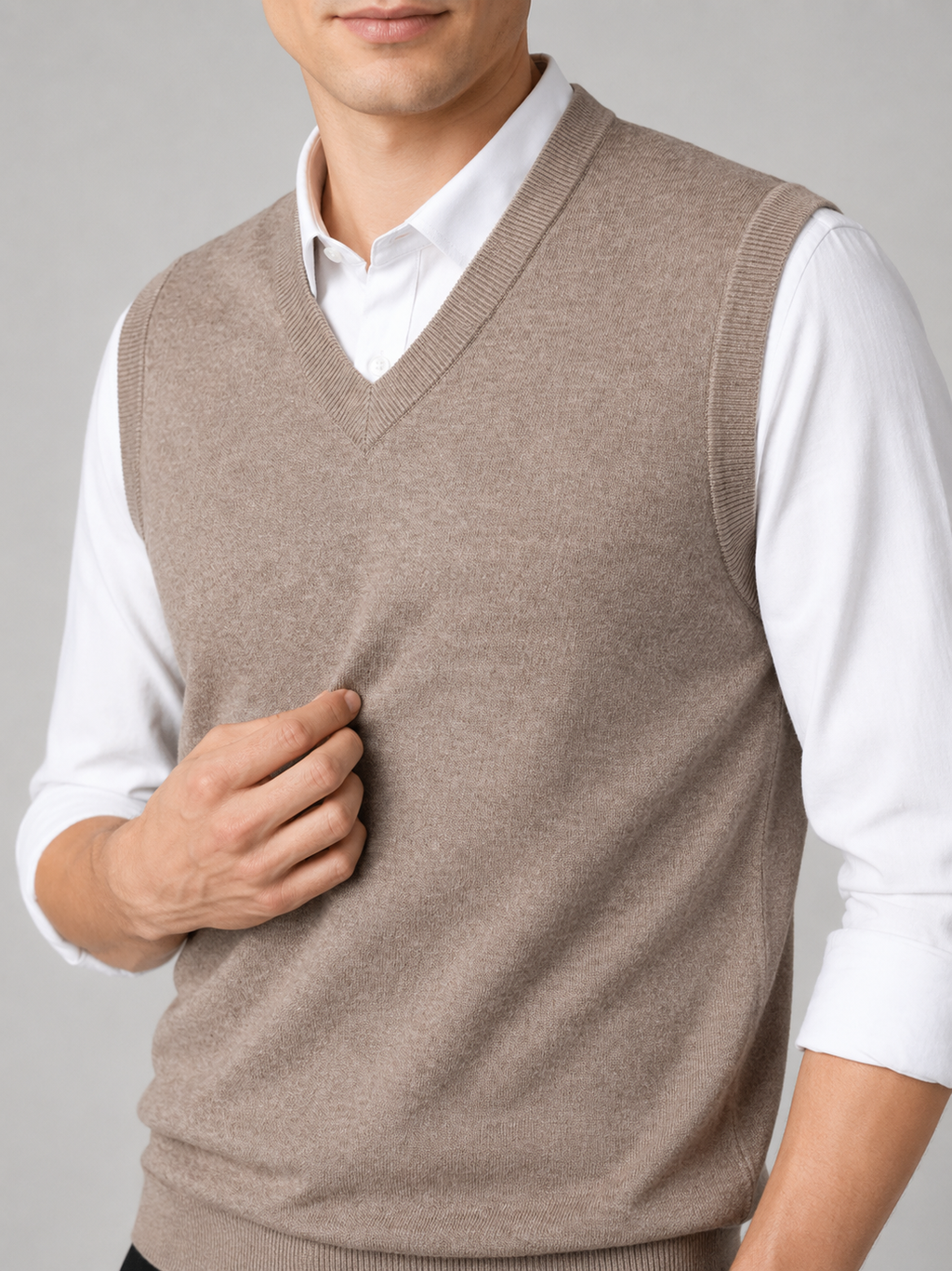Close up of khaki sweater vest showing soft knit texture and classic v neck detail