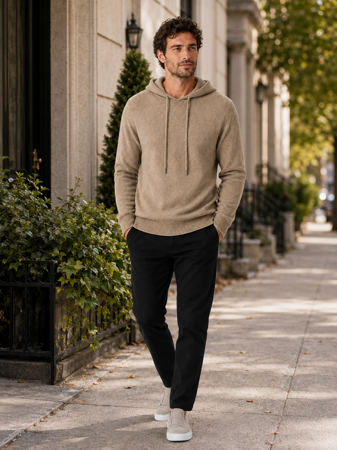 Man wearing a khaki wool hoodie sweater in a casual fall winter outfit for everyday wear