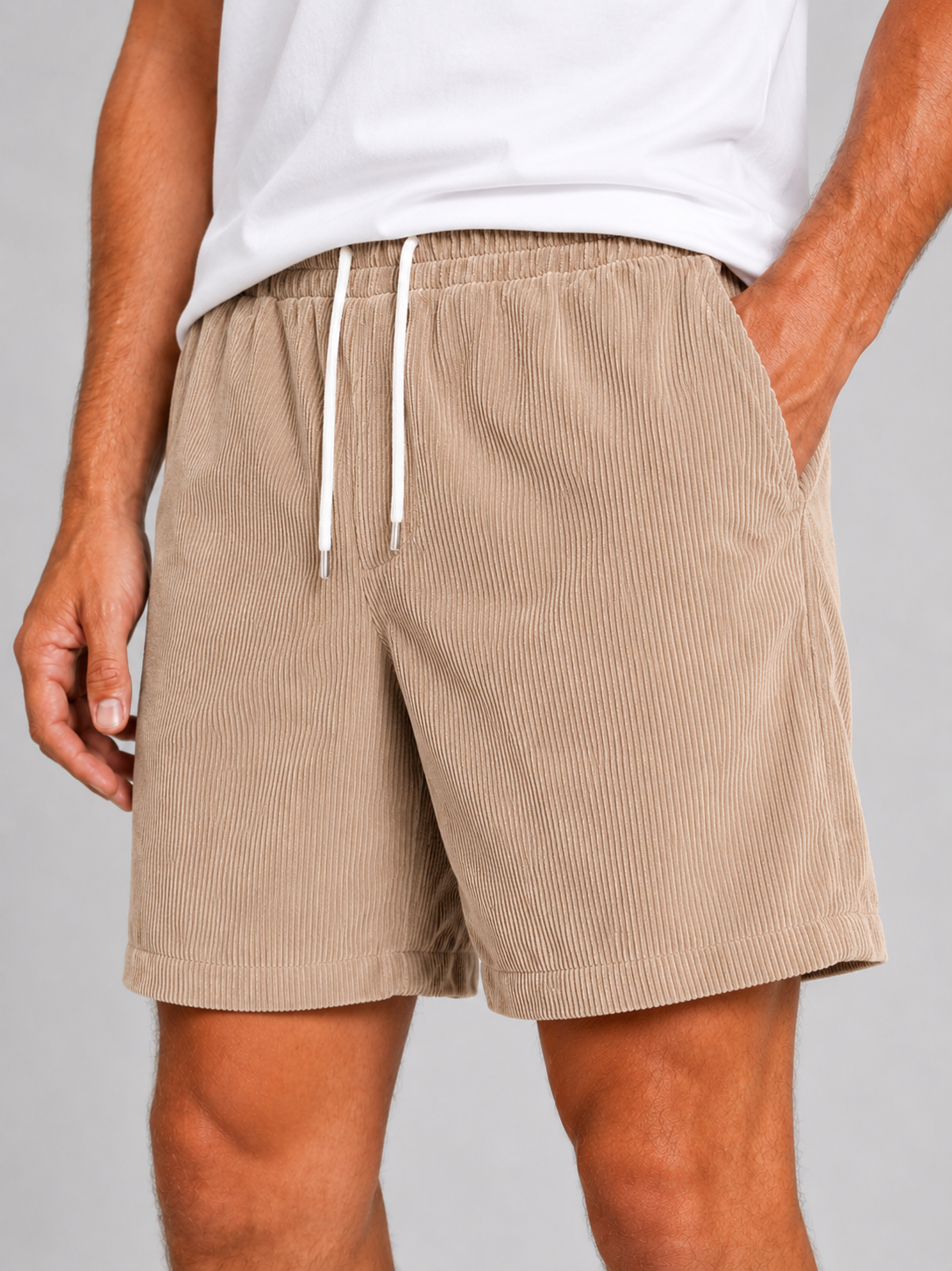 Close up of khaki corduroy shorts showing soft textured fabric and adjustable drawstring waistband