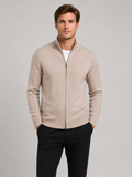 Front view of a man wearing a khaki full zip knit sweater with a stand collar, slim fit, long sleeves, and warm fall winter design