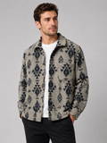 Front view of a man wearing a khaki heavyweight flannel jacket with thick brushed fabric, button-up front, long sleeves, and warm wool-blend shacket design