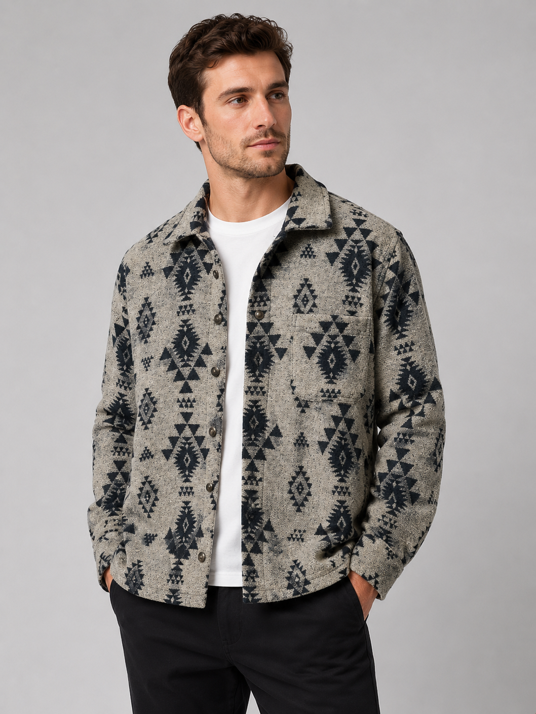 Front view of a man wearing a khaki heavyweight flannel jacket with thick brushed fabric, button-up front, long sleeves, and warm wool-blend shacket design