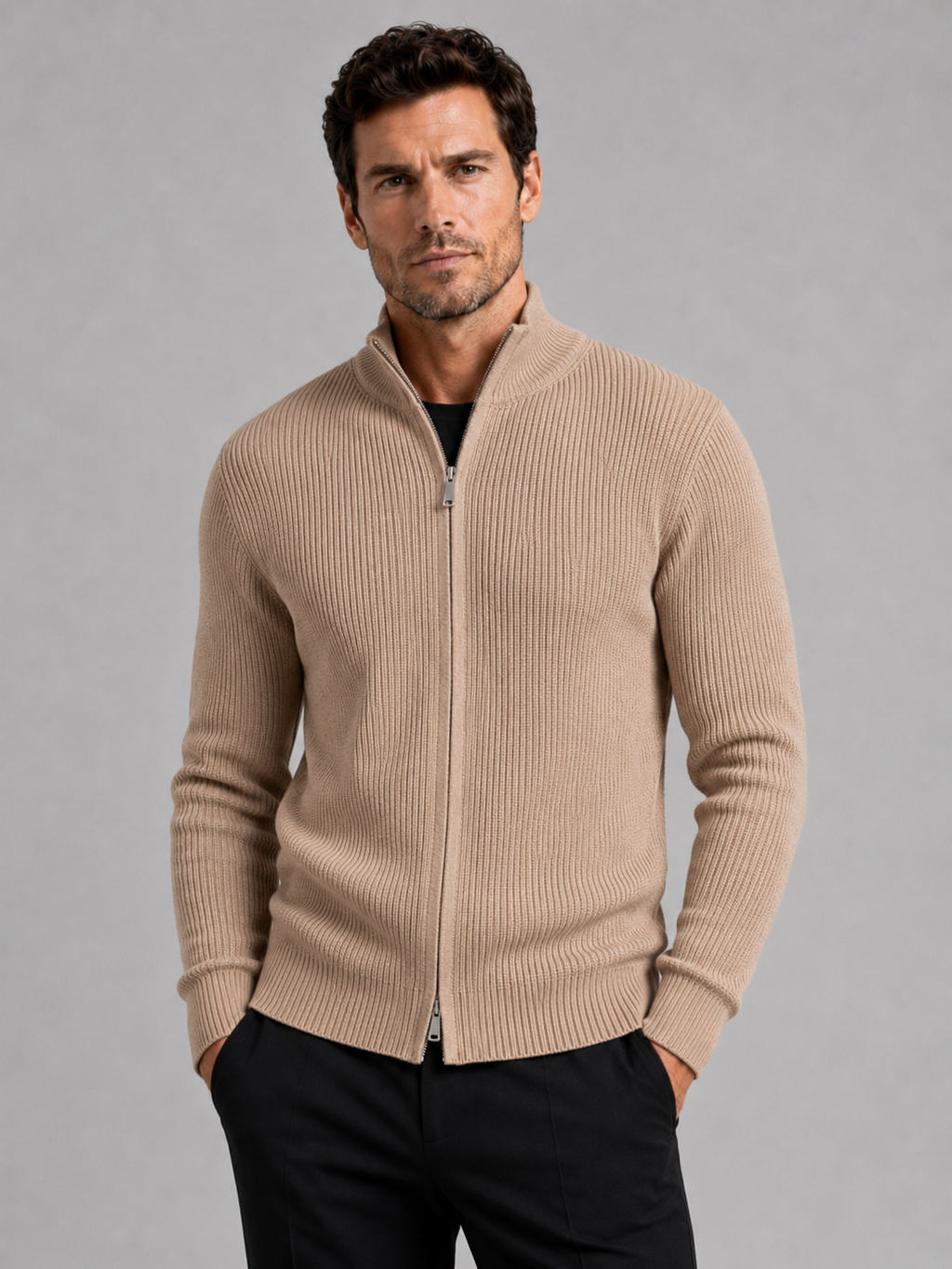 Front view of a man wearing a khaki ribbed knit cardigan sweater with a full zip front, stand collar, slim fit, and long sleeves