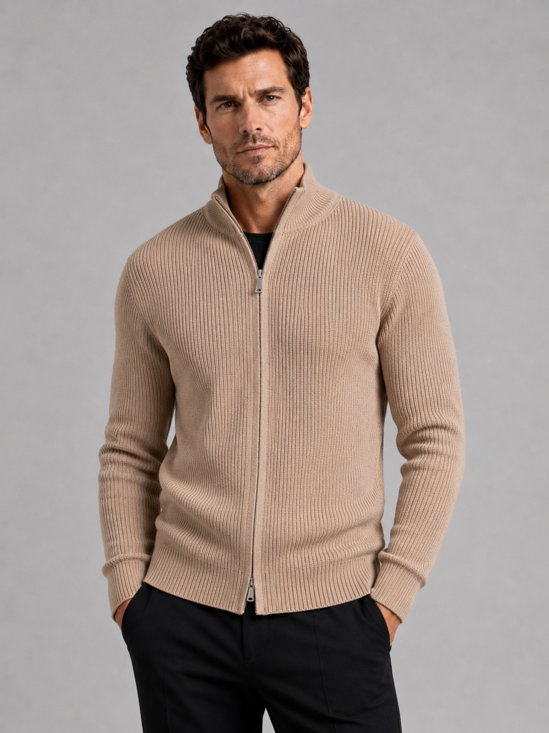 Front view of a man wearing a khaki ribbed knit cardigan sweater with a full zip front, stand collar, slim fit, and long sleeves
