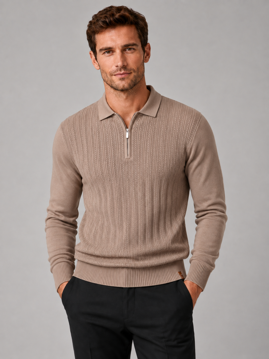 Front view of a man wearing a khaki quarter zip polo shirt with a slim fit, textured fabric, long sleeves, and structured collar