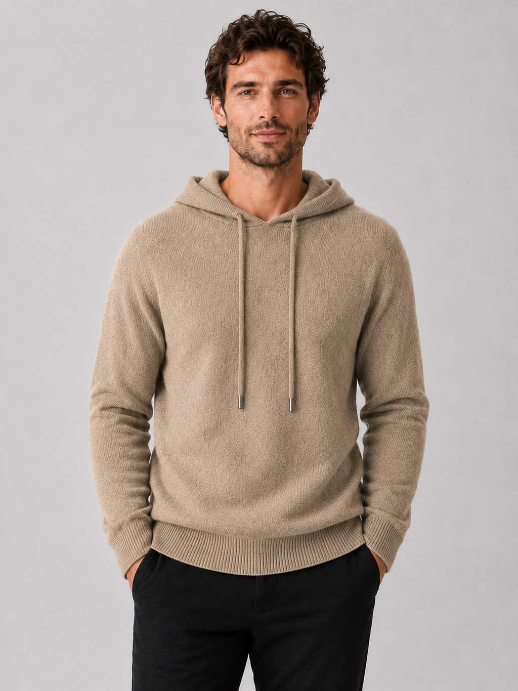 Front view of a man wearing a khaki wool hoodie sweater with a soft knit design, attached hood, and long sleeves