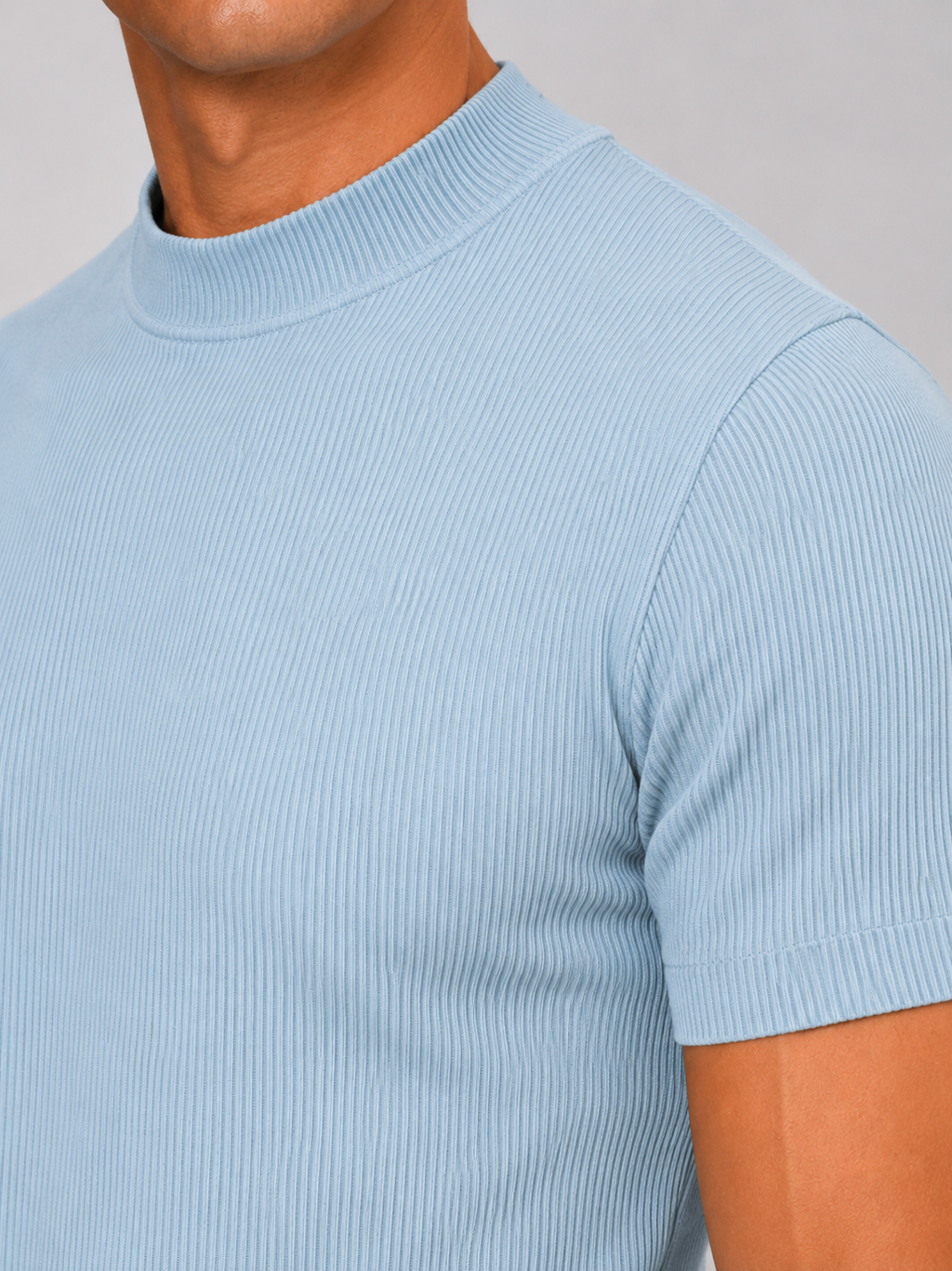 Close up of light blue ribbed t shirt showing soft stretch fabric and mock neck detail