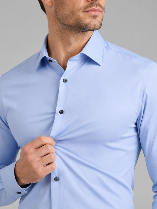 Close up of light blue dress shirt showing wrinkle resistant stretch fabric and crisp collar detail