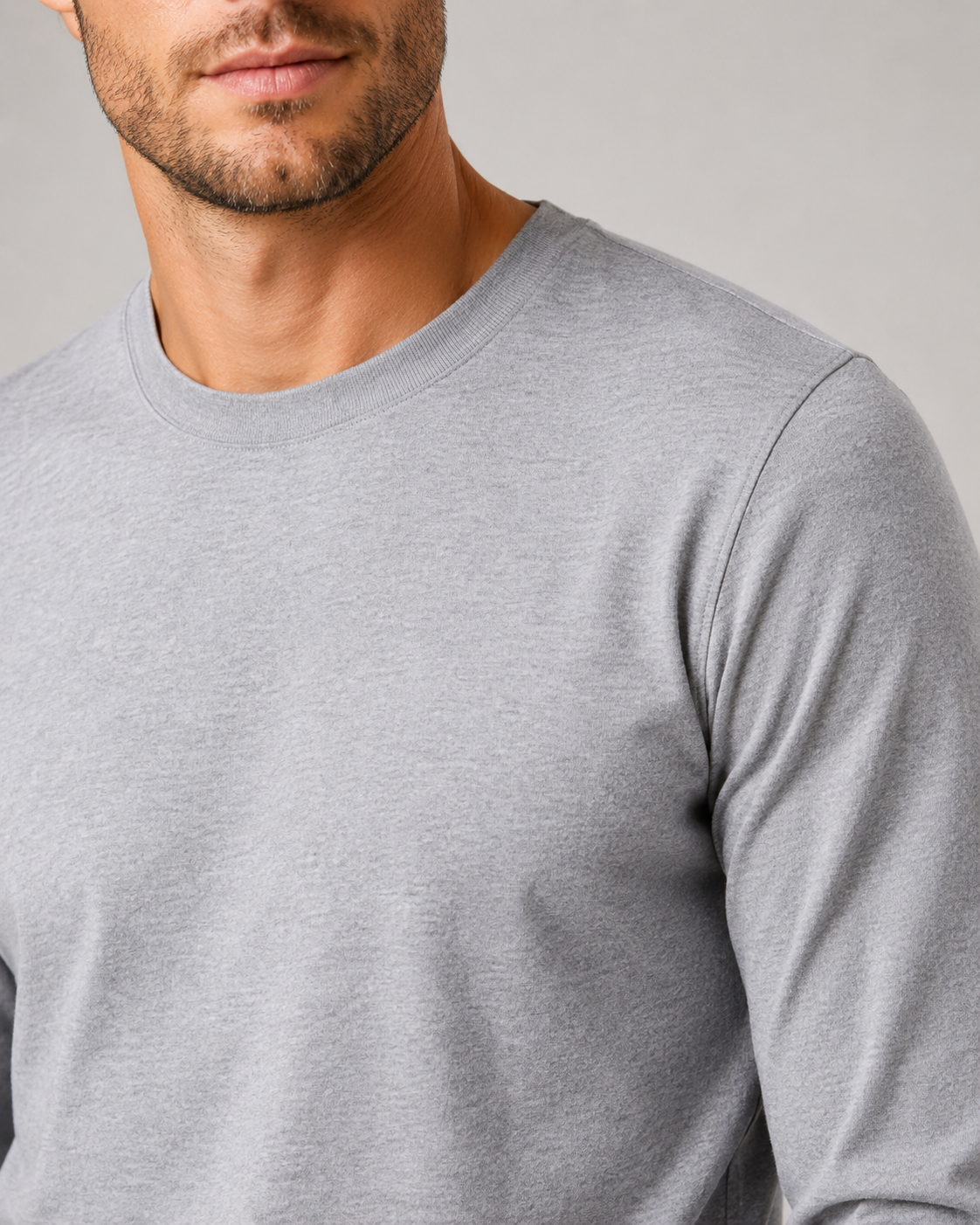 Close up of light gray t shirt fabric showing soft smooth breathable texture
