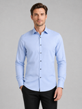 Men wearing light blue button down shirt long sleeve non iron stretch business casual office style