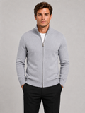 Front view of a man wearing a light gray full zip knit sweater with a stand collar, slim fit, long sleeves, and warm fall winter design