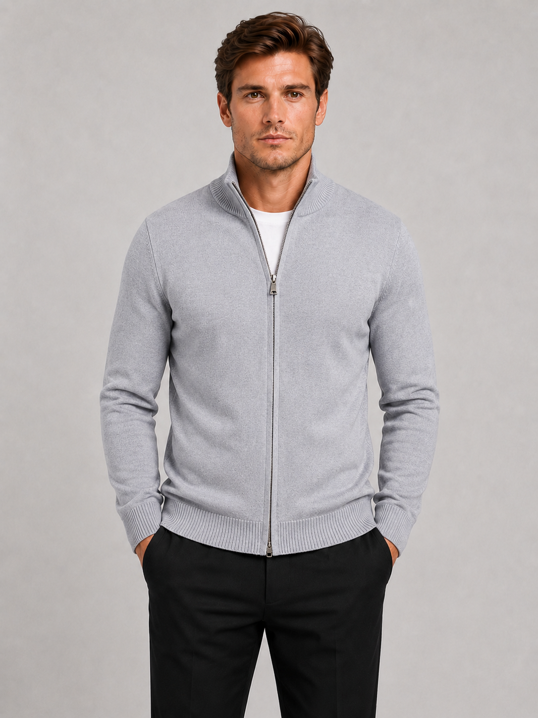 Front view of a man wearing a light gray full zip knit sweater with a stand collar, slim fit, long sleeves, and warm fall winter design