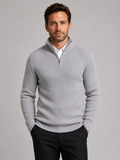 Front view of a man wearing a light gray slim fit quarter zip sweater with a mock neck and long sleeves