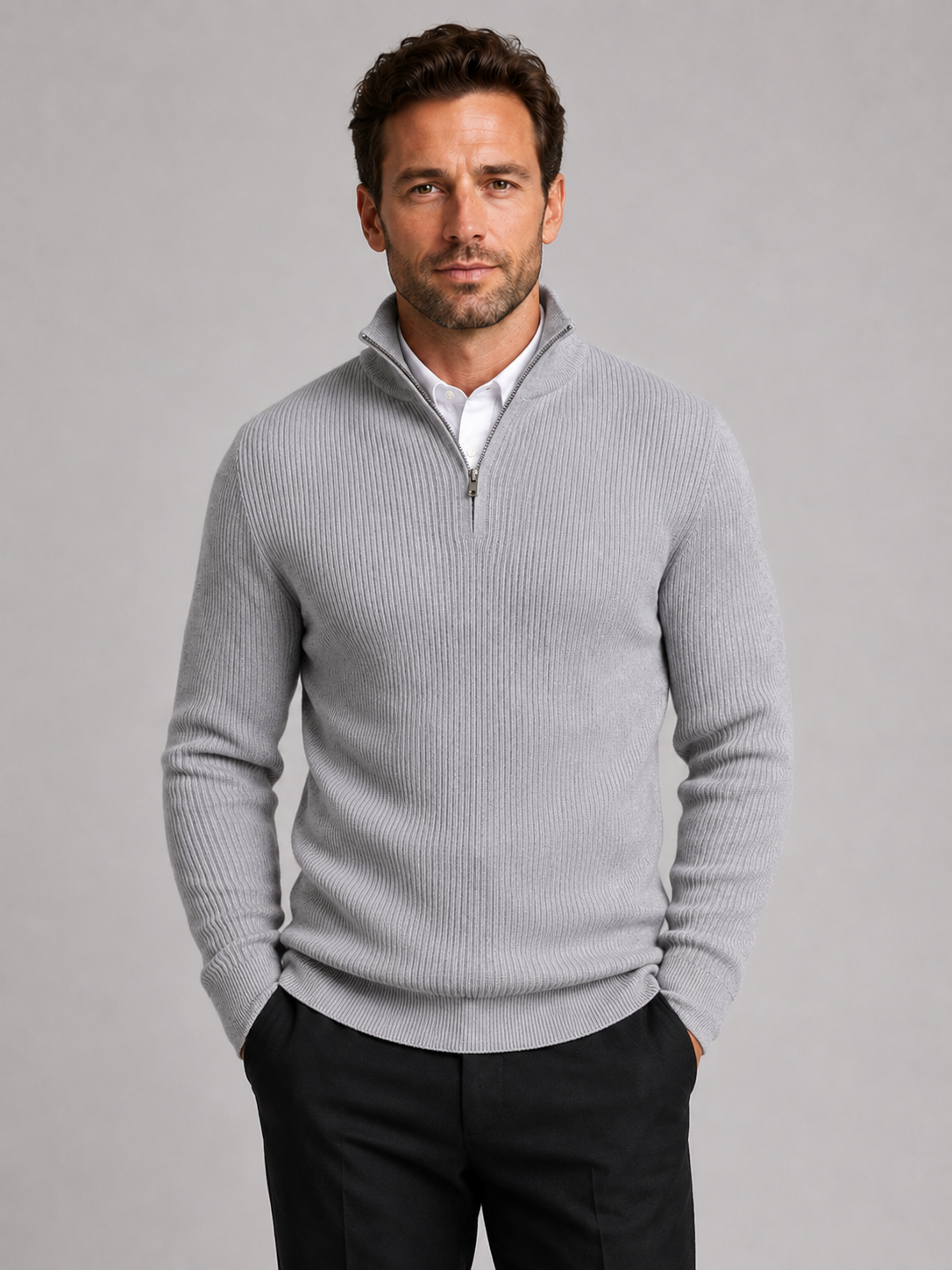 Front view of a man wearing a light gray slim fit quarter zip sweater with a mock neck and long sleeves