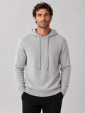 Front view of a man wearing a light gray wool hoodie sweater with a soft knit design, attached hood, and long sleeves