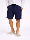 Men wearing navy linen drawstring shorts relaxed fit lightweight breathable summer casual style