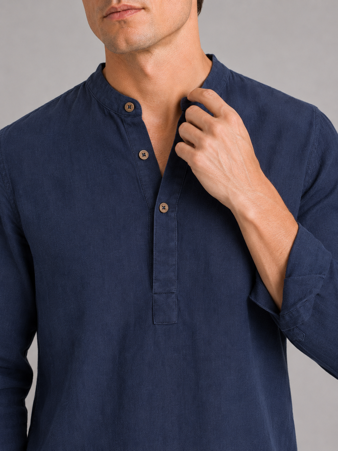Close up of navy band collar shirt showing lightweight breathable fabric and clean collar detail