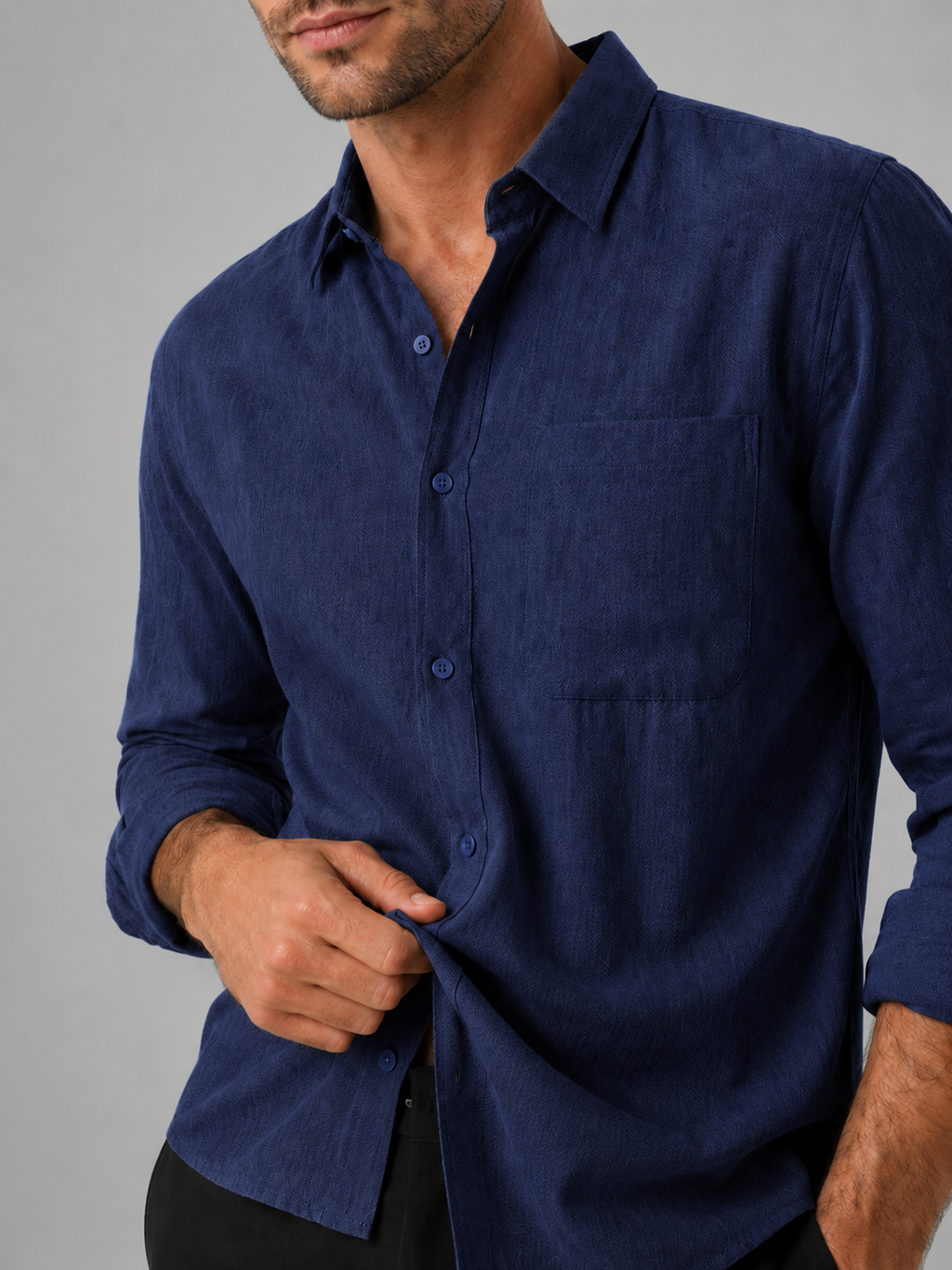 Close up of navy button down shirt showing lightweight breathable fabric and classic collar detail