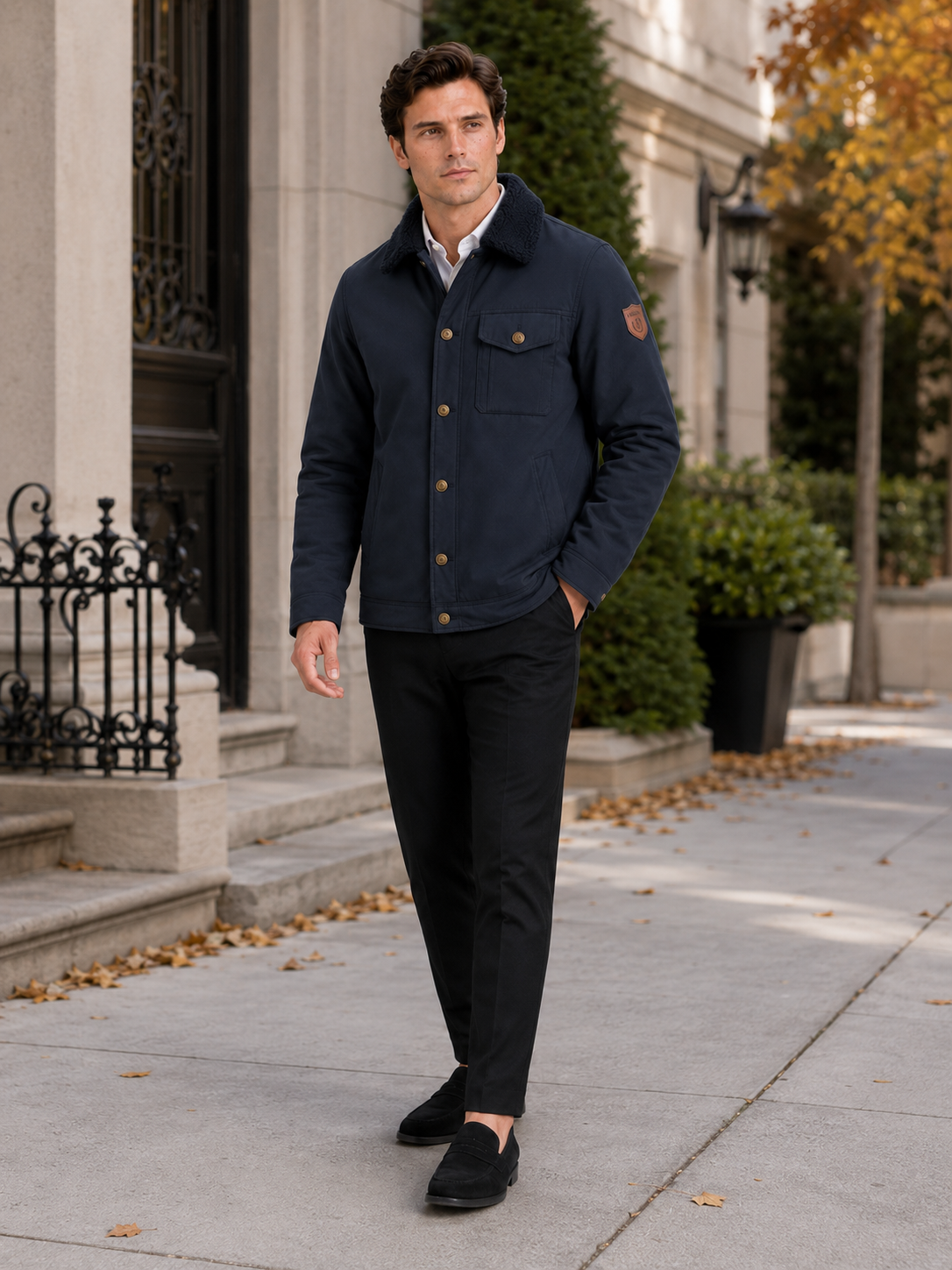 Man styling navy fleece winter jacket in a refined outdoor and everyday lifestyle outfit