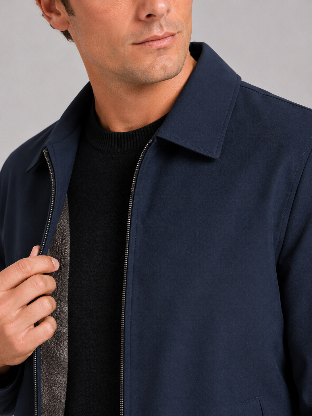Close up of navy fleece lined jacket showing soft thermal lining and classic turn down collar detail