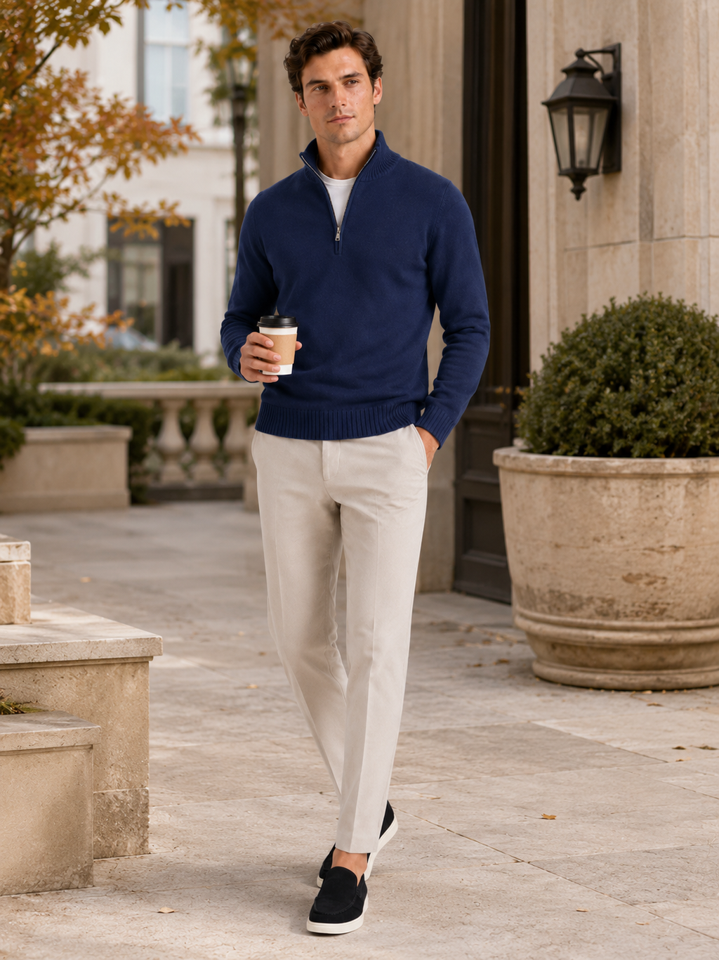 Man styling navy half zip sweater in a refined fall lifestyle outfit